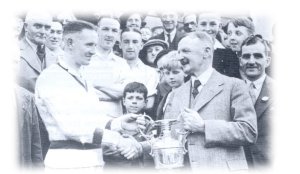 Tommy Lowe Snr receives the League Championship Trophy, 1939
